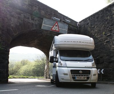 Motorhome driving under low bridge