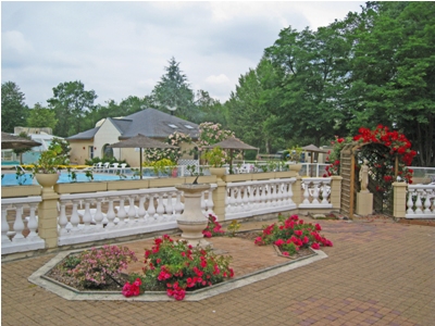 Rose gardens next to the heated outdoor swimming pool