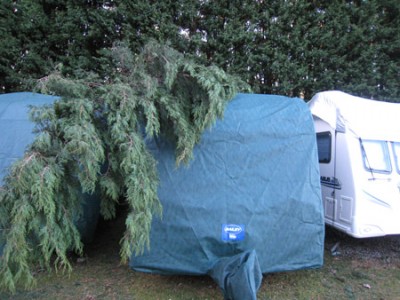 Caravan cover protects tourer from fallen tree