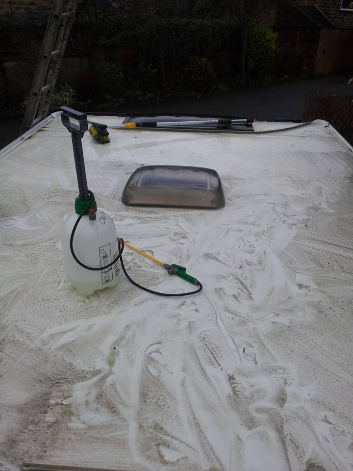 Caravan roof being cleaned