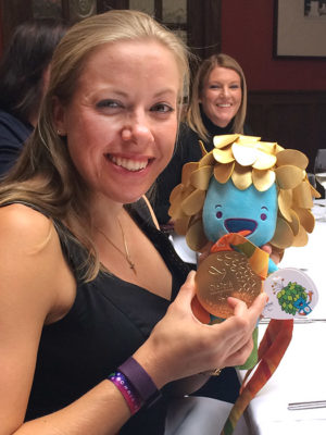 Hannah Cockroft with Rio Paralympics Gold medal and mascot (Louise in background)