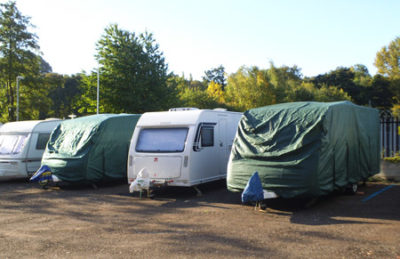 caravans in storage with caravan covers