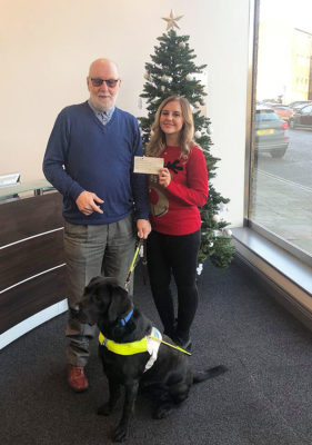 Guide dogs for the blind receive cheque from Caravan Guard for charity-mas