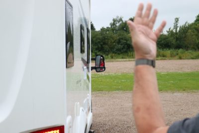 Give clear instructions when helping to reverse a motorhome