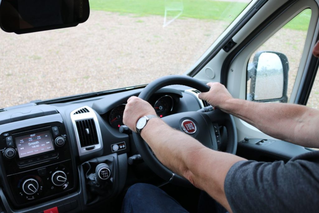 Motorhome reversing two hands on the wheel