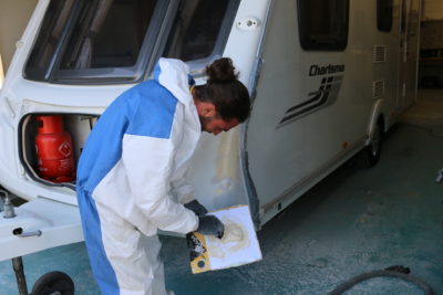 repairing the damage on a caravan