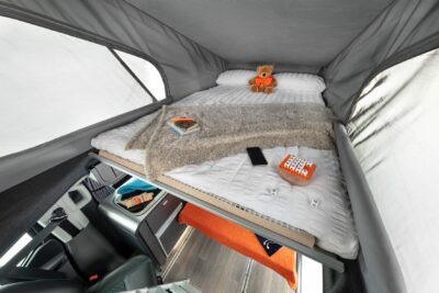 Pop top bed in Swift Monza campervan