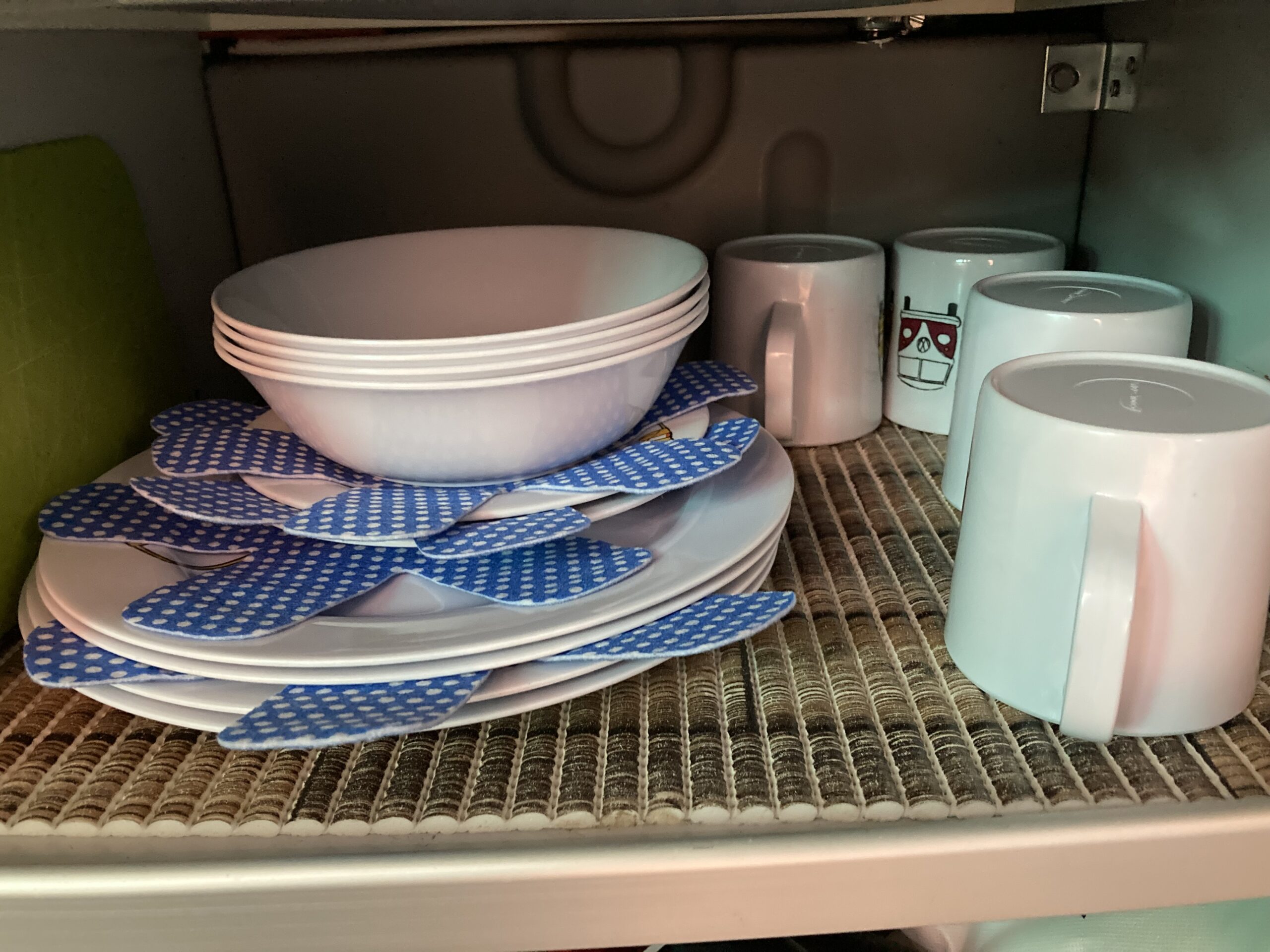 Plates in a motorhome cupboard