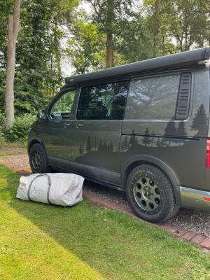awning in bag in front of the campervan 