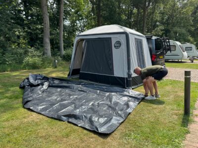 laying ground sheet in front of the awning to take down