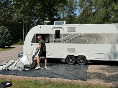 unpacking awning on to the groundsheet