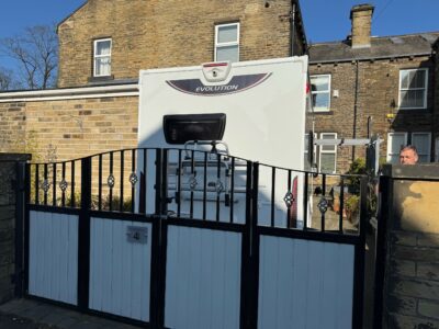 motorhome behind locked gates